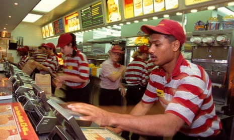 Staff serve customers at the McDonald's branch in Brent Cross, London