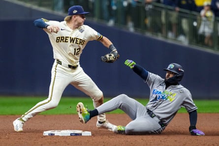 Milwaukee shortstop Cooper Pratt fails to complete a game-ending double play against Tampa Bay in Game 1 of the World Series on Friday night.