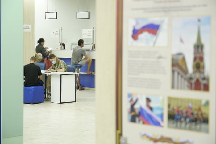 Russia-Ukraine war: Kyiv and Moscow sign deal to allow grain exports from blockaded Black Sea ports – live 9 In occupied Kherson people arrive at an office to receive Russian passports.