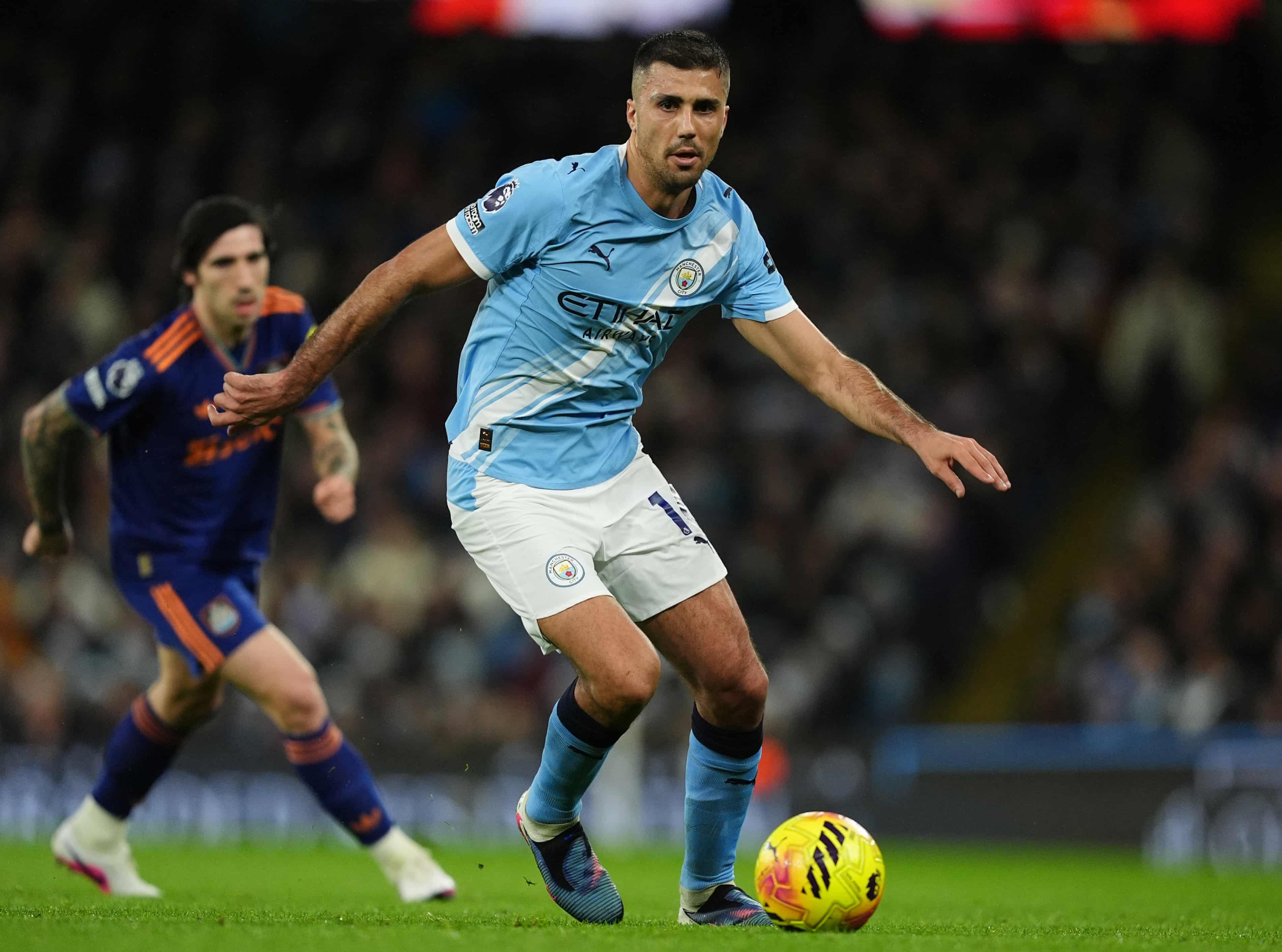 Rodri controlling the ball during a competitive match