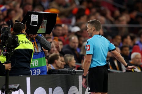Referee Alejandro Hernandez checks the VAR screen before disallowing a goal scored by Virgil van Dijk