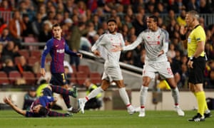 Liverpool’s Joel Matip reacts after fouling Barcelona’s Luis Suarez.