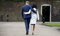 FILE - In this Monday Nov. 27, 2017 file photo Britain’s Prince Harry and Meghan Markle walk away after posing for the media in the grounds of Kensington Palace in London. Prince Harry and his wife Meghan are ending their lives as senior members of Britain’s royal family and starting an uncertain new chapter as international celebrities and charity patrons. In January the couple shocked Britain by announcing that they would step down from official duties, give up public funding, seek financial independence and swap the U.K. for North America. The split becomes official on March 31. (AP Photo/Alastair Grant, File)