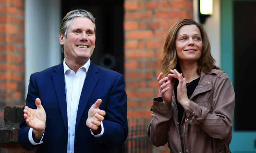 Keir Starmer and his wife Victoria applaud NHS and key workers outside their home in May.