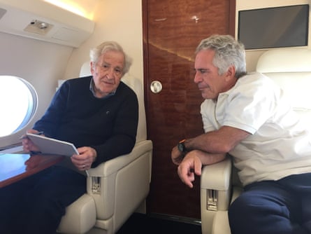 Two men speak while seated in a plane