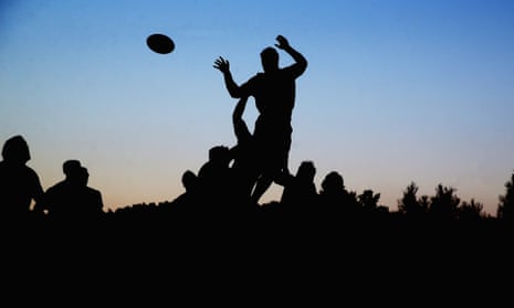 silhouette of rugby players