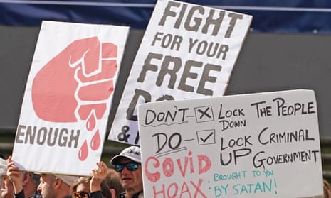 Signs at an anti-lockdown protest in Melbourne, Australia, this month