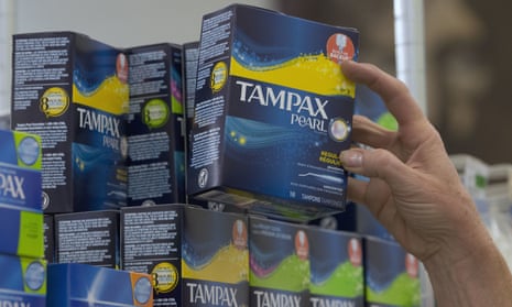 Hand reaching for a box of tampons