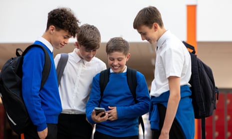 School boys with a mobile phone.