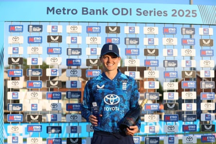 Amy Jones with her player of the match award after England beat West Indies