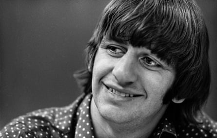Close-up of Starr, smiling and looking to the right of the camera