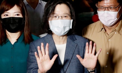 Tsai Ing-Wen with hands up in front of her.