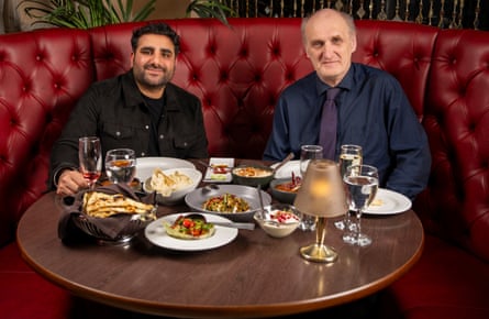 Two men sitting at a restaurant table