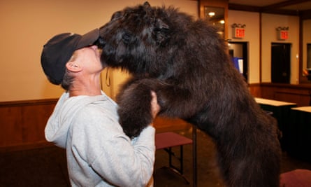 A dog greets his handler at Hotel Pennsylvania