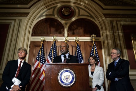 a man surrounded by two men and and a woman