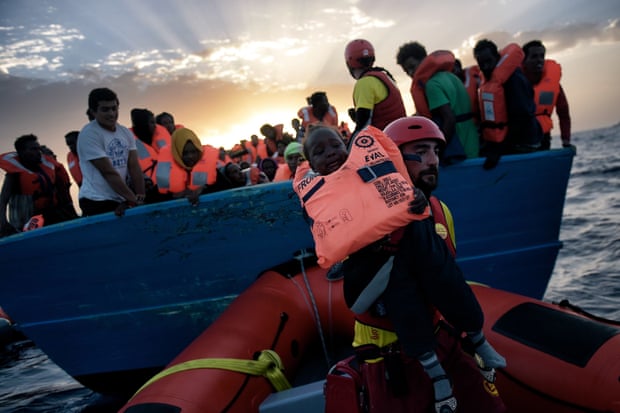 A child is rescued from a vessel in the Mediterranean, north of Libya, on 3 October