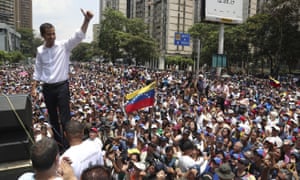 Opposition leader Juan Guaidó flashes a thumbs up at supporters during a rally in Caracas on Wednesday.