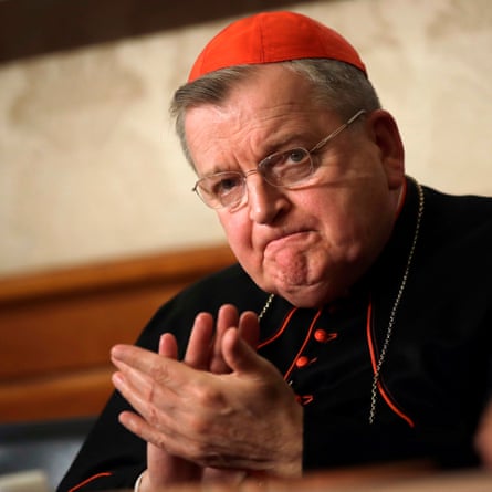 Raymond Burke applauding during a news conference in Rome in 2018.