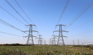 Electricity pylons carry power away from Dungeness nuclear power station in Kent.