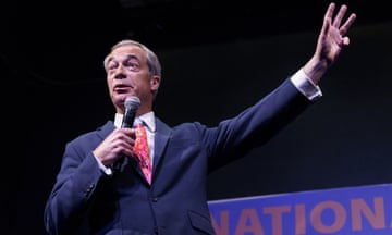 Farage at mic with hand in air