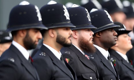 Officers attend a Metropolitan police passing out parade for new recruits