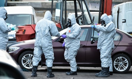 Forensic police officers examine a vehicle believed to belong to the poisoned Russian double agent Sergei Skripal.