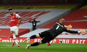 Arsenal’s Pierre-Emerick Aubameyang tucks the ball past Leicester keeper Kasper Schmeichel to open the scoring.