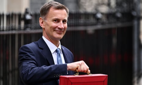 Jeremy Hunt leaving Downing Street before delivering the spring budget on 15 March 2023