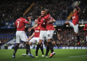 Van Persie with Ashley Young after scoring at Stamford Bridge in October 2012