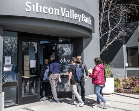 Customers queue outside the collapsed Silicon Valley Bank in Santa Clara, California.