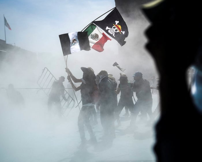 Gen Z protesters confront police at National Palace in Mexico City – video
