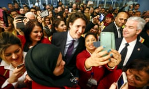 Canada’s self-proclaimed feminist prime minister Justin Trudeau poses with Toronto airport workers.