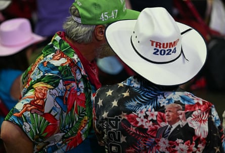 Supporters wear Trump Hawaiian shirts as they wait to hear former Donald Trump.