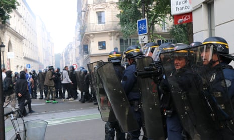 Demonstration in Paris<br>PARIS, FRANCE - JULY 14: Thousands of people, who opposed the mandatory new type of coronavirus (Covid-19) vaccine gather during a protest, on July 14, 2021 in Paris, France. Riot police intervened in protestors with tear gas, demonstrators clashed with the police, broke the windows of banks and shops, overturned trash cans and set up barricades on the roads. The demonstrators also set fire to garbage containers and construction equipment. (Photo by Alaattin Dogru/Anadolu Agency via Getty Images)