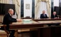 Vladimir Putin sits at a table with Andrei Troshev and Yunus-Bek Yevkurov.