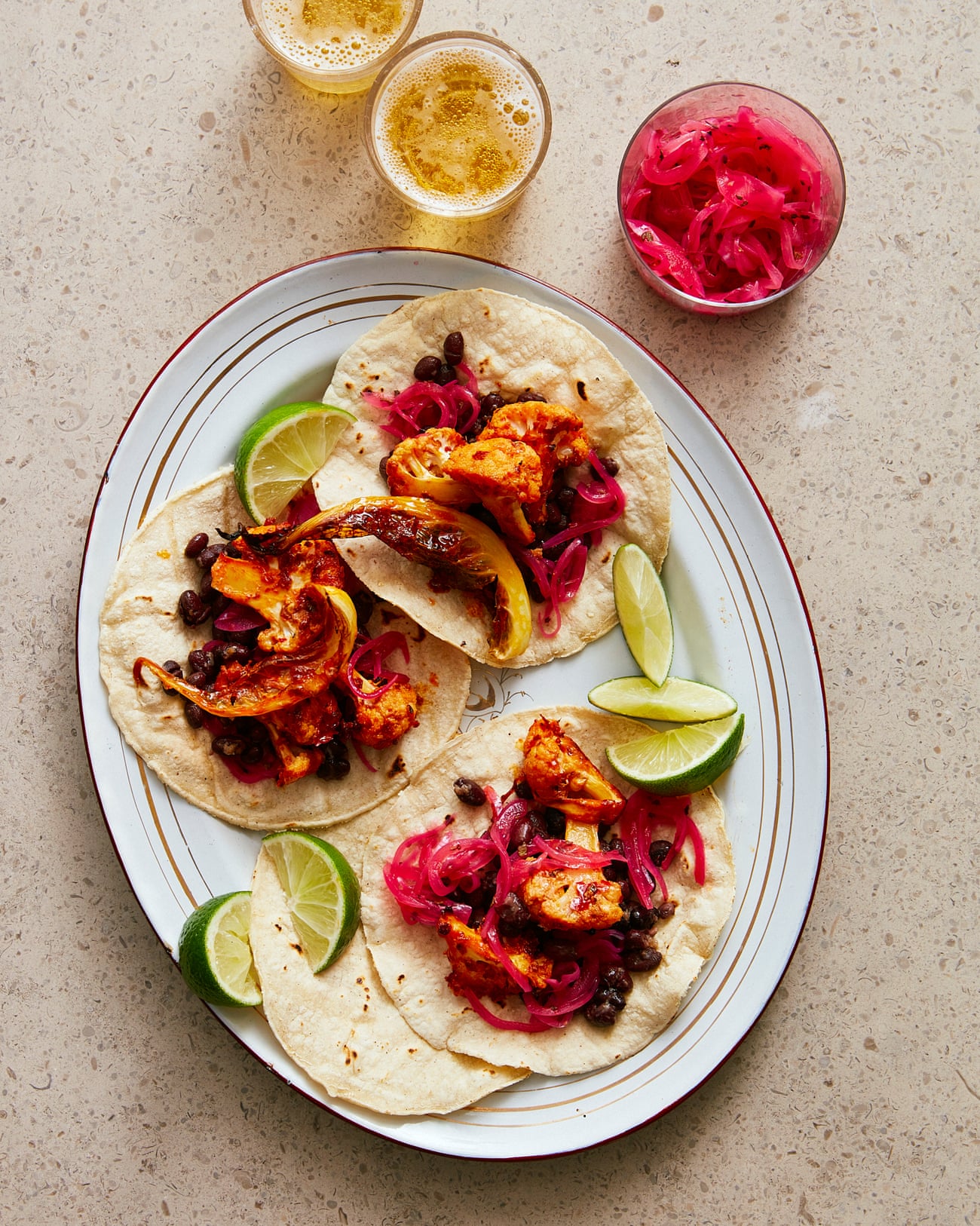 Thomasina Miers' roast cauliflower tacos with pink pickled onions.