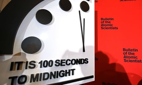 The Doomsday Clock reads 100 seconds to midnight, indicating the planet remains dangerously close to nuclear and climate change catastrophe.