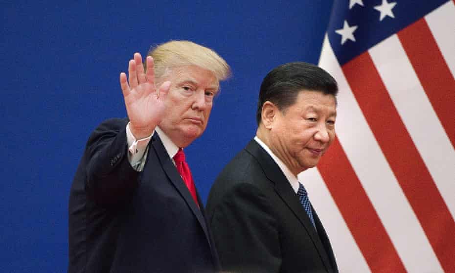 Donald Trump and Xi Jinping leaving an event in Beijing. The trade war between the two countries has weighed on the world economy.