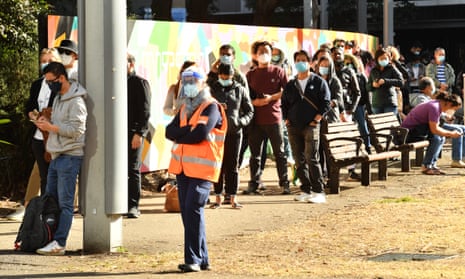 People queue to receive their coronavirus vaccination in Sydney
