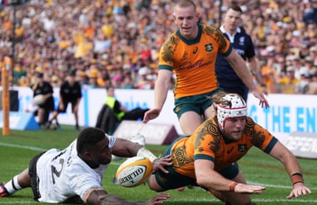 Australia's Fraser McReight, right, scores a try as Fiji's Josua Tuisova, left, comes in too late during their match last week.