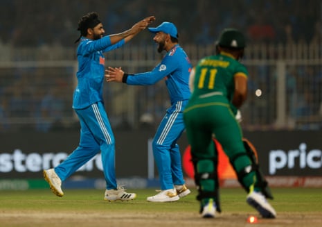 India's Ravindra Jadeja celebrates with Virat Kohli after taking the wicket of South Africa's Temba Bavuma.
