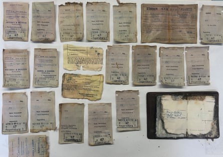 A number of frayed pages with writing on them.