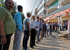 People queue outside bank in Lucknow, India