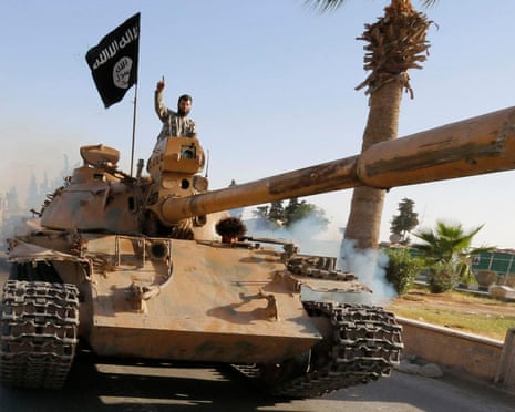 Militant Islamic State fighters in a military parade in Syria’s northern Raqqa province