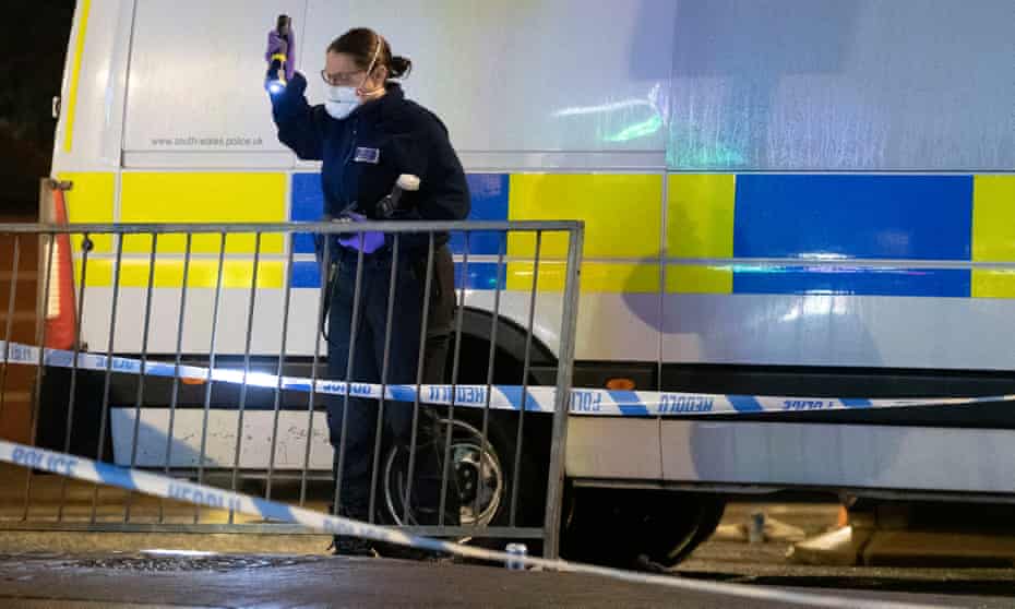 A police crime scene investigator  on Queen Street on November 22, 2020 in Cardiff, Wales.