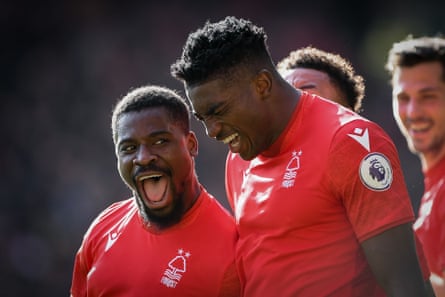 Serge Aurier of Nottingham Forest celebrates with Taiwo Awoniyi after scoring against Liverpool at the City Ground