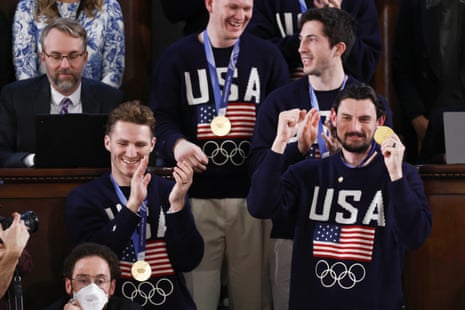 Team USA hockey goalie Connor Hellebuyck stood with his teammates.