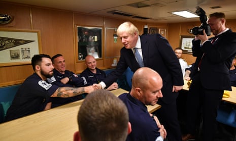 Boris Johnson meeting crew members in the mess hall of HMS Victorious at HM Naval Base Clyde in Faslane,
