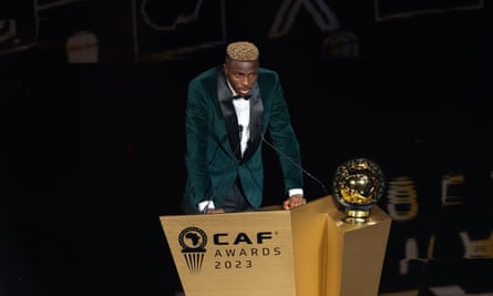 Victor Osimhen collects his award, the first Nigerian male player to win since 1999.