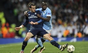 Bacary Sagna, right, tussles with Gareth Bale in the Champions League semi-final, Manchester City’s first, that was won by Real Madrid.